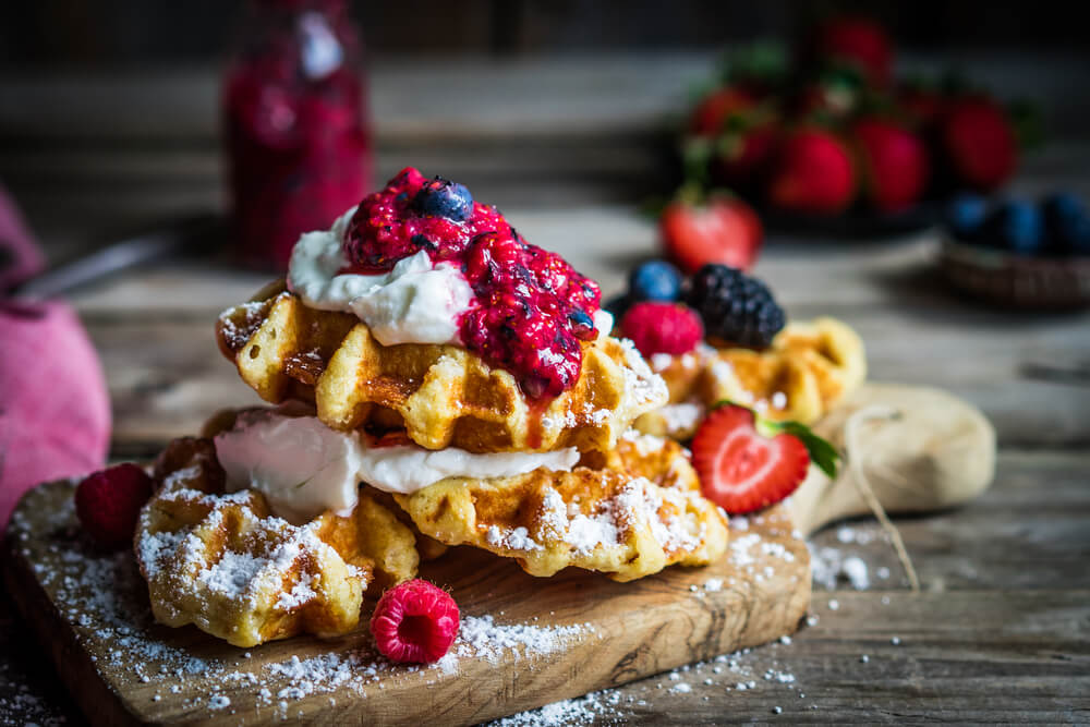 Belgian,Waffles,With,Fresh,Berries,On,Rustic,Wooden,Background